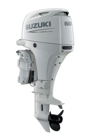 A white suzuki outboard motor sitting on top of a boat.